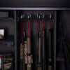 Image of Interior view of a fireproof gun safe with electronic lock, showcasing organized storage for long guns.