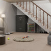 Image of Remington Express 44-gun safe placed under stairs in a cozy living space, ideal for securing firearms and valuables.